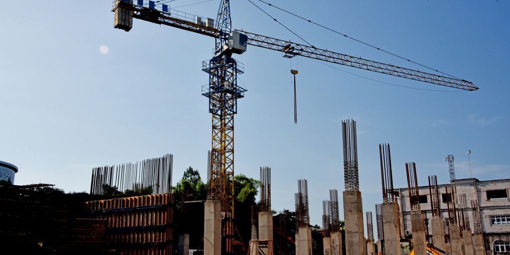 a construction site with a crane in the background