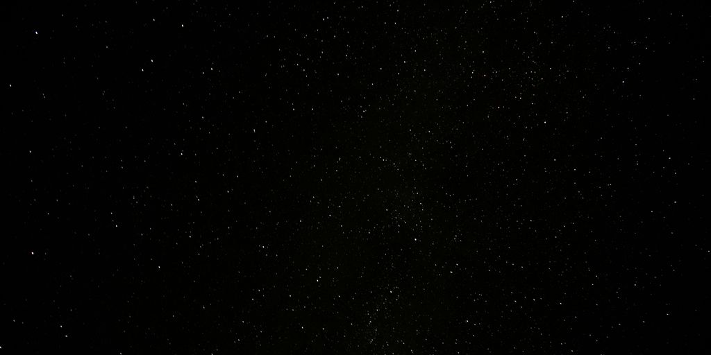 a black sky with a lot of stars